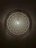 Round Filigree Brass Wall Light with intricate hand-perforated brass design